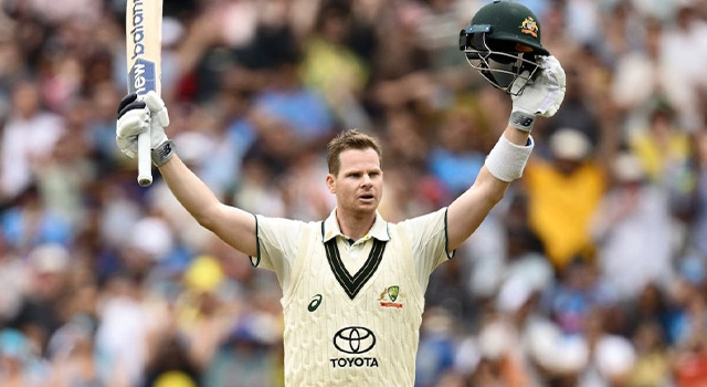 Smith raises the bat after 34th test century